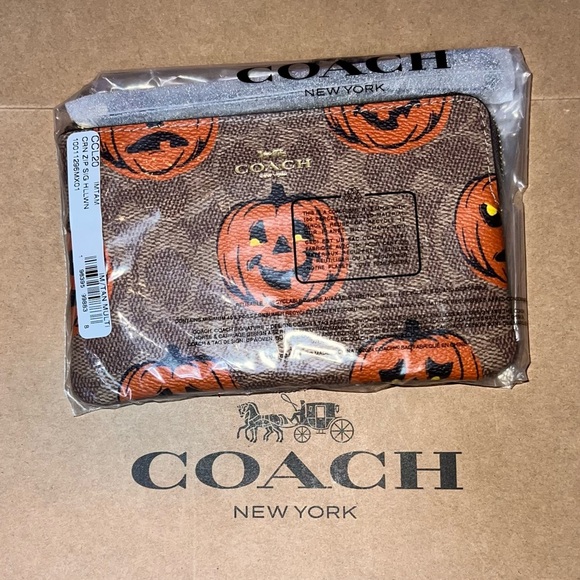 Coach Handbags - NWT COACH Halloween Corner Zip Wristlet Signature Canvas w Pumpkin Print CCL20